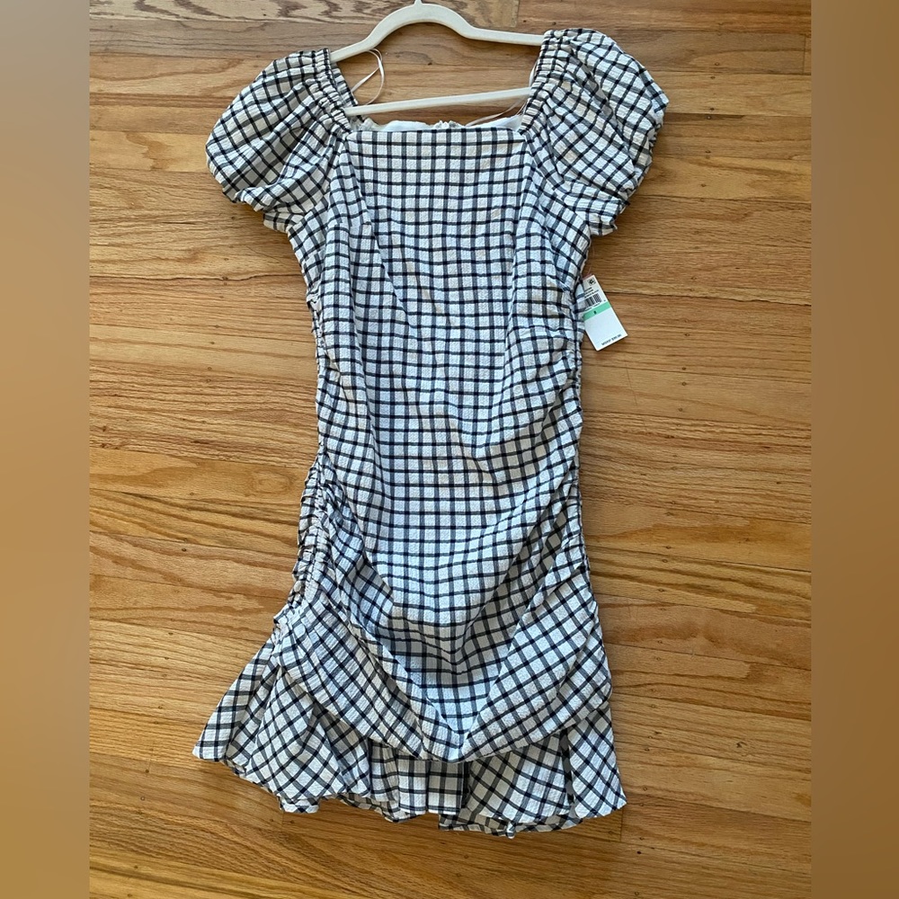 NWT Riley & Rae mini dress with frills at bottom. Cinched waist.